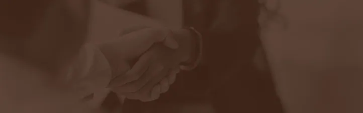 Two people shaking hands.